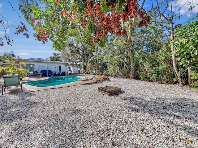 outdoor pool featuring a patio