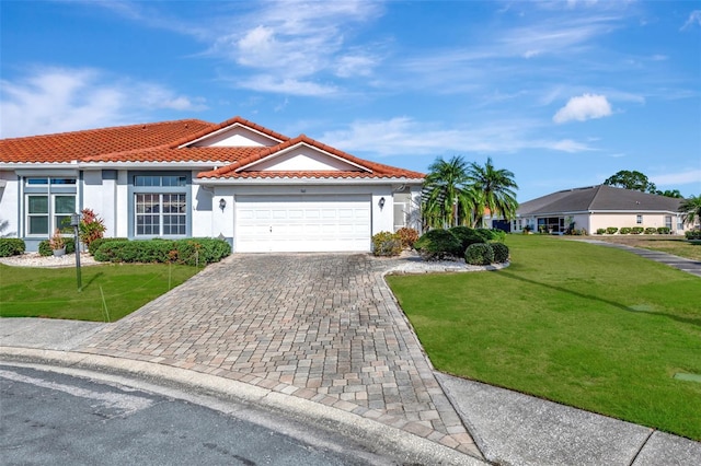 view of front facade featuring a front yard and a garage