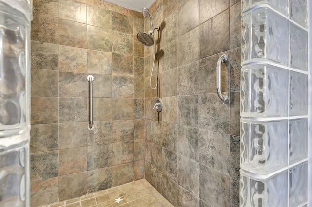 bathroom with tiled shower