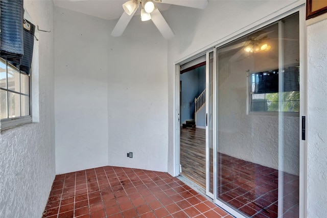 interior space featuring ceiling fan