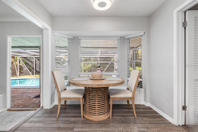 dining area with dark hardwood / wood-style floors