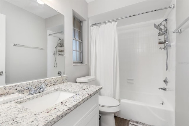 full bathroom with shower / tub combo, vanity, and toilet