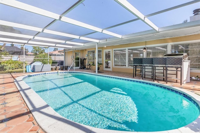 view of pool featuring a patio area and a lanai