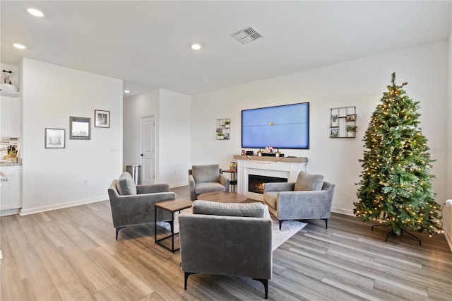 living room with light hardwood / wood-style flooring