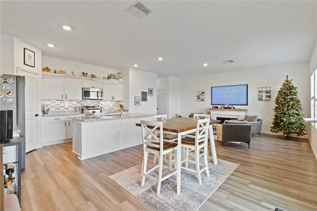 dining area featuring light hardwood / wood-style floors