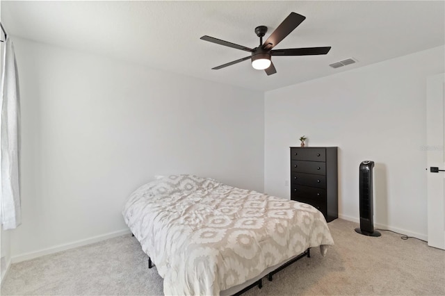 bedroom with light carpet and ceiling fan