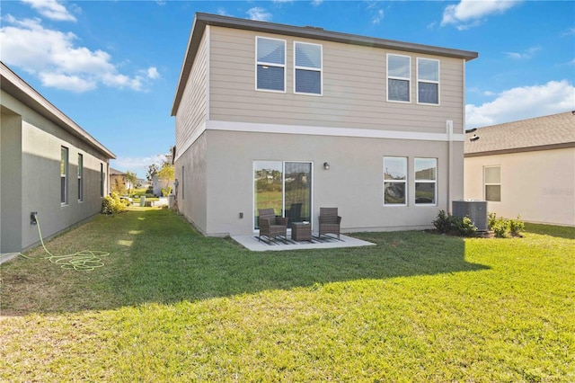 back of house with a yard, a patio, and central AC unit