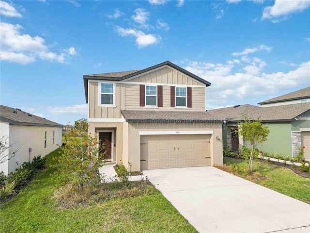 view of front of property featuring a garage and a front lawn