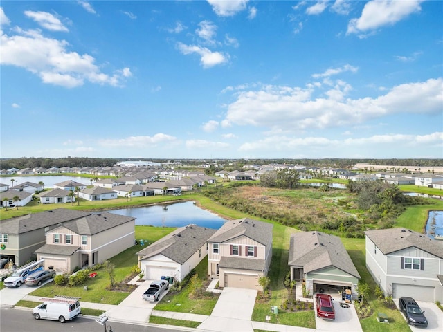 bird's eye view with a water view