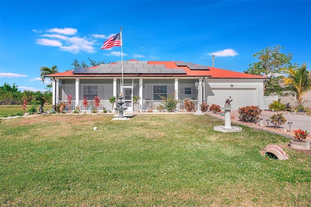 view of front facade featuring solar panels, a porch, a garage, and a front yard