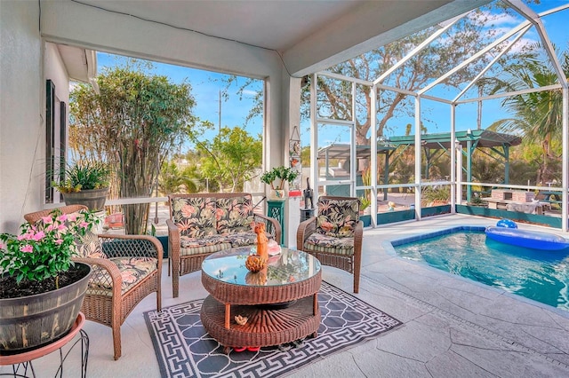 view of swimming pool with a lanai, an outdoor living space, and a patio