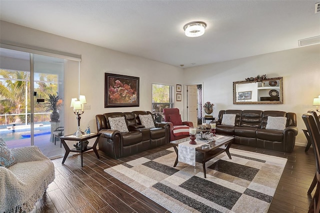 living room with dark hardwood / wood-style floors