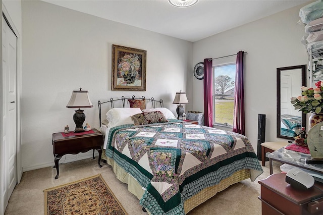 bedroom featuring light carpet