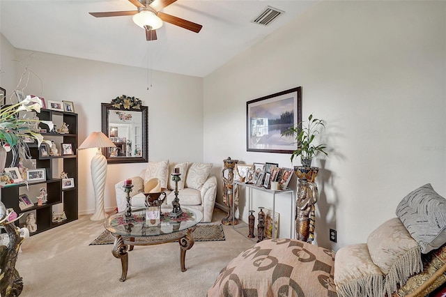 carpeted living room featuring ceiling fan