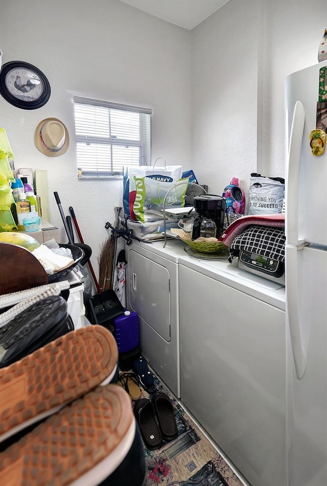 washroom with independent washer and dryer