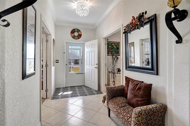 entrance foyer with an inviting chandelier, light tile patterned floors, and ornamental molding