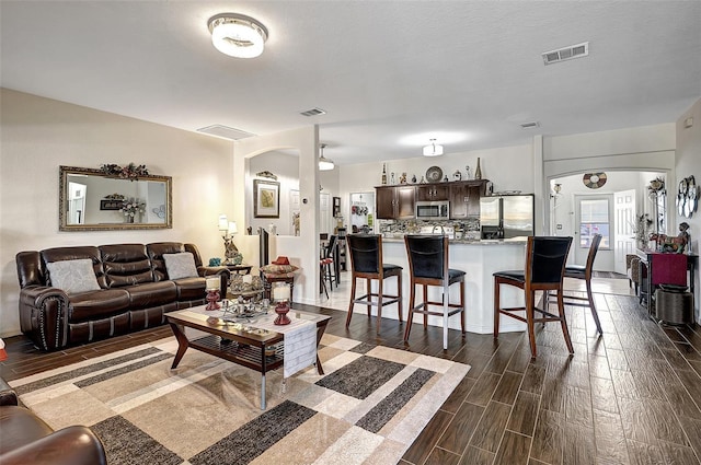 living room featuring a textured ceiling