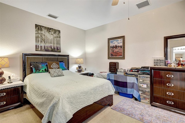 bedroom with ceiling fan and light colored carpet