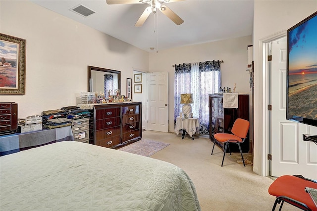 bedroom with light carpet and ceiling fan