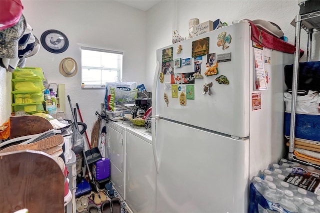 kitchen featuring washer / dryer and white refrigerator