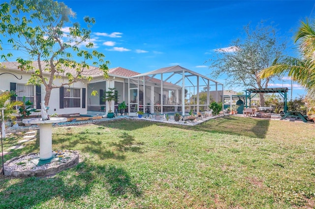 back of house with a lawn, glass enclosure, and a pergola