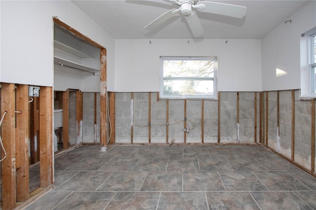 unfurnished room with ceiling fan