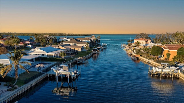 aerial view at dusk with a water view