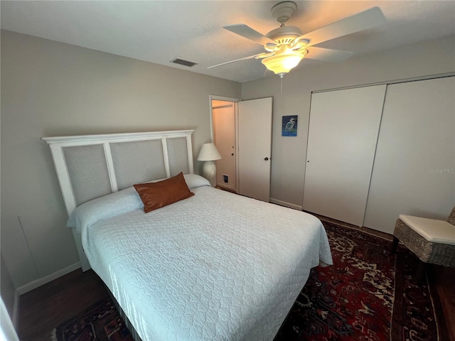 bedroom with ceiling fan and a closet