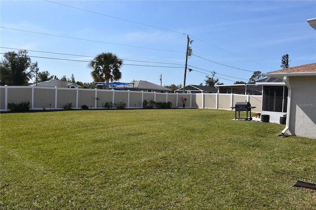 view of yard featuring a sunroom