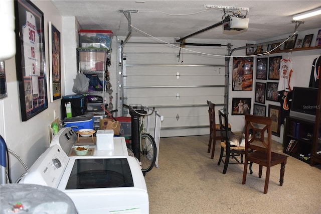 garage featuring a garage door opener and separate washer and dryer