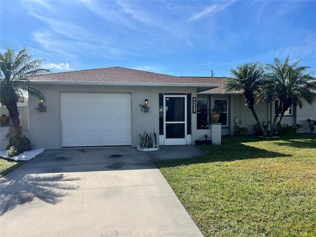 single story home featuring a garage and a front yard