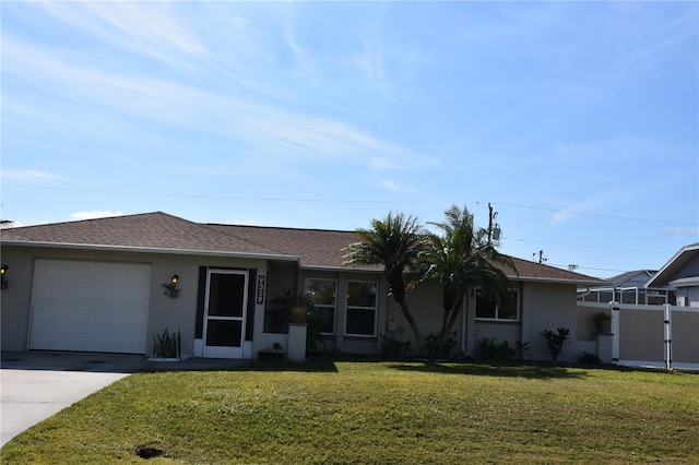 ranch-style home with a garage and a front lawn