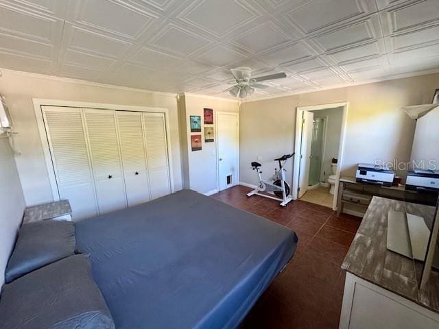 bedroom with ceiling fan and a closet