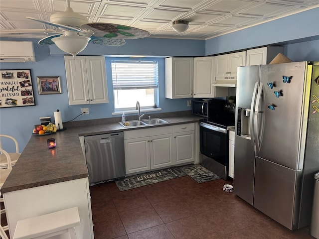 kitchen featuring ceiling fan, sink, a wall mounted air conditioner, white cabinets, and appliances with stainless steel finishes