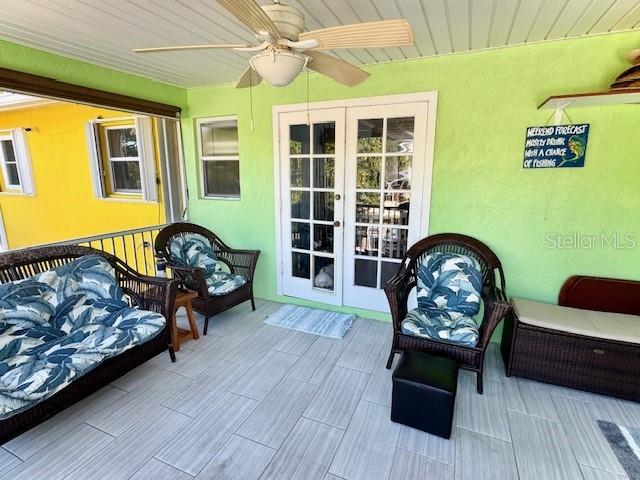 exterior space with french doors and ceiling fan