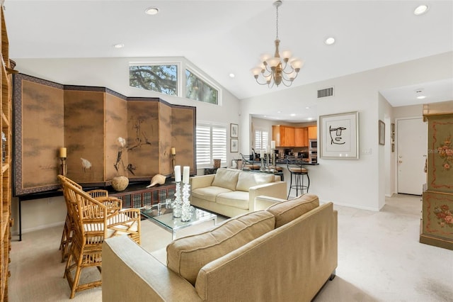 carpeted living room featuring a chandelier and lofted ceiling