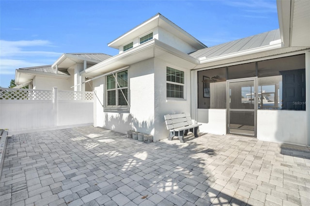 view of patio / terrace with a sunroom