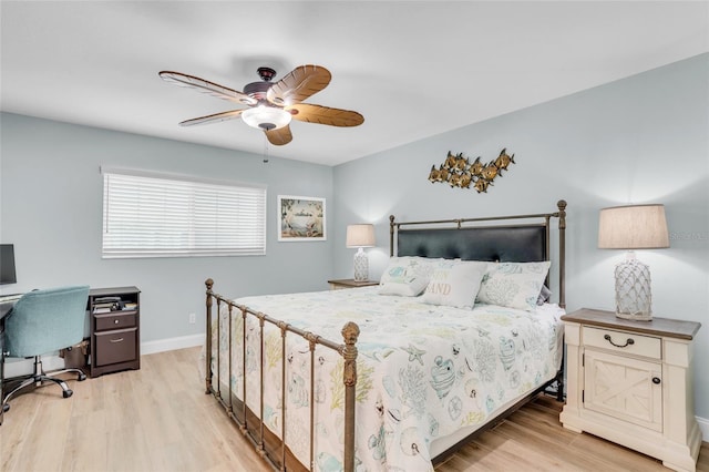 bedroom with ceiling fan and light hardwood / wood-style floors