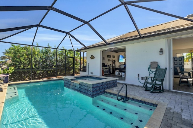 view of swimming pool with a lanai, an in ground hot tub, and a patio