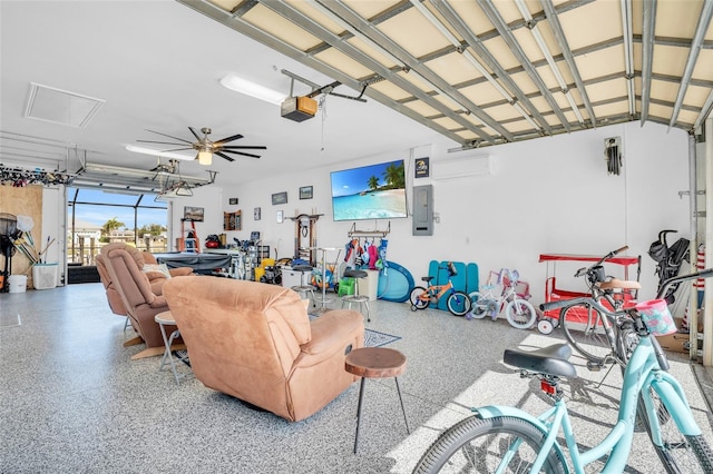 garage featuring electric panel, ceiling fan, and a garage door opener