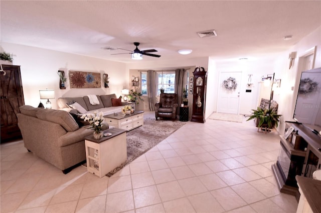 living room with light tile patterned flooring and ceiling fan