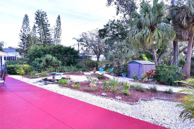 view of home's community featuring a storage shed and an outdoor structure