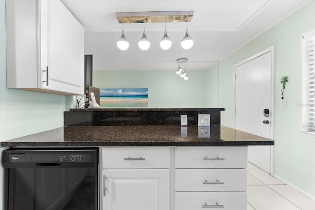 kitchen featuring dishwasher, dark stone counters, rail lighting, hanging light fixtures, and white cabinetry