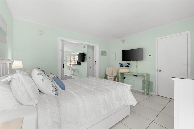 bedroom featuring light tile patterned floors