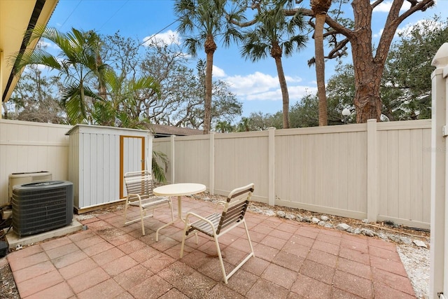 view of patio / terrace featuring a storage unit and central air condition unit