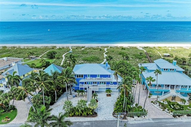 birds eye view of property featuring a water view and a view of the beach