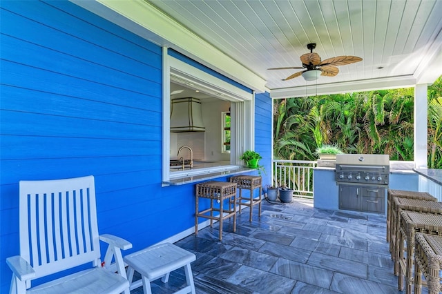 view of patio / terrace featuring ceiling fan and a grill