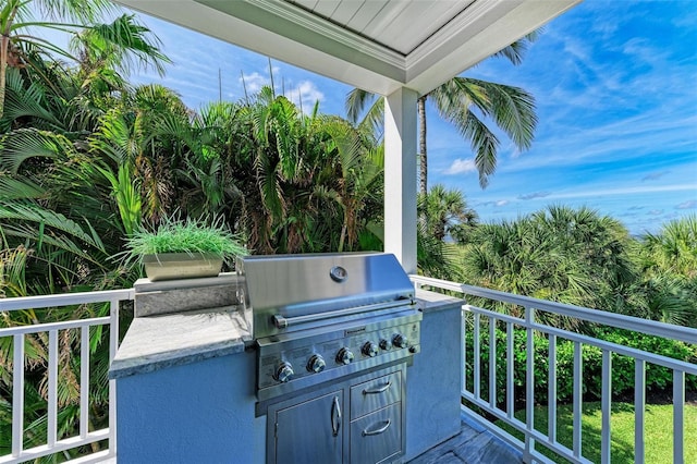 view of patio with area for grilling and exterior kitchen