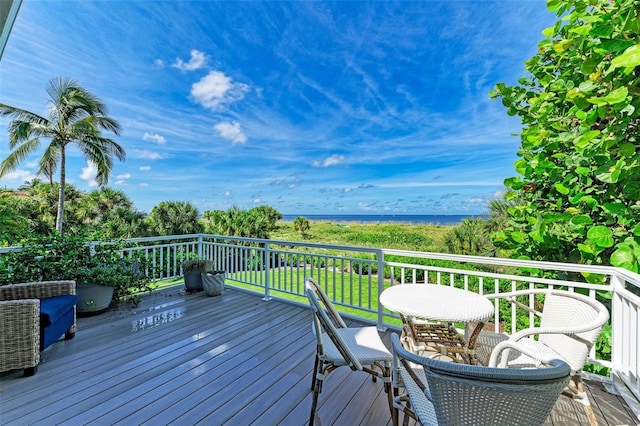 wooden deck featuring a water view