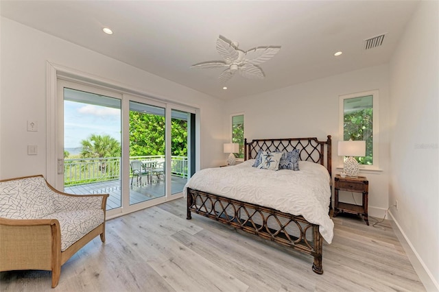 bedroom featuring ceiling fan, light hardwood / wood-style floors, and access to exterior